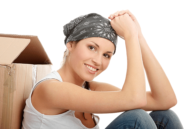 Woman leaning on a box of items to donate